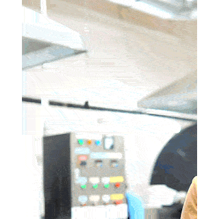 Production hall with a machine control panel at the European factory where Briters laundry sheets are made