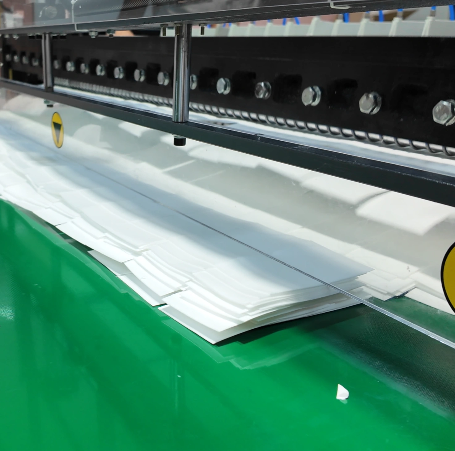 Laundry sheets being cut to size, one sheet per wash